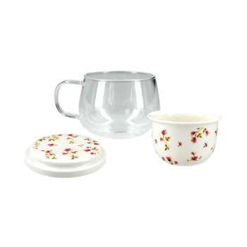 Kubek szklany z ceramicznym zaparzaczem i przykrywką.